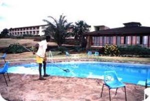 man cleaning a pool